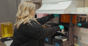 Dr. Giardina's team member using advanced 3D printing technology to create custom retainers at Giardina Orthodontics in Harrisonburg, Virginia