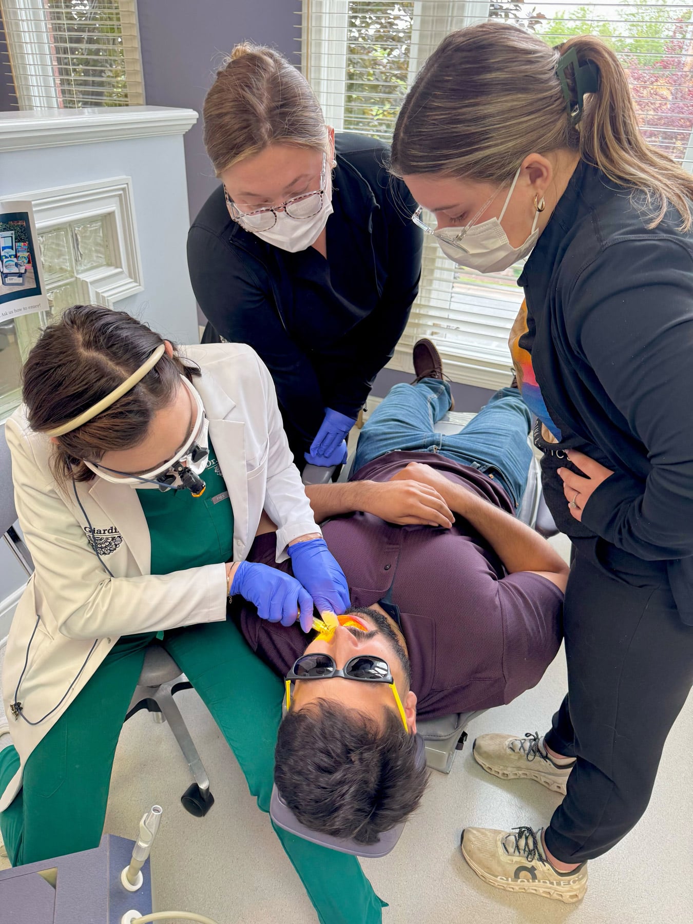 Dr. Giardina and orthodontic team performing detailed treatment planning for adult Invisalign patient at Giardina Orthodontics in Harrisonburg, VA