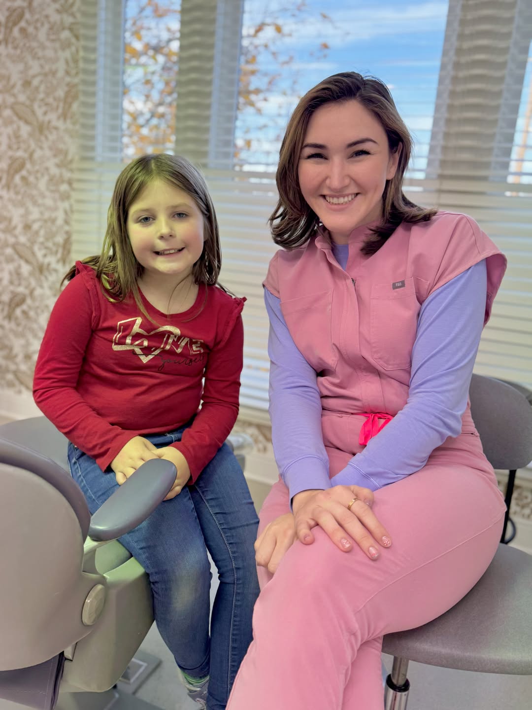 Board-Certified orthodontist in Broadway VA Dr. Giardina smiling with happy young patient at Harrisonburg office